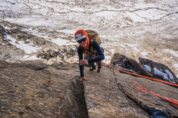 A climber on a granite face with BC at his feet. 