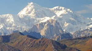 Mooses Tooth Peak (midground) with Denali in the distance Photo Paxson Woebler Wiki Commons