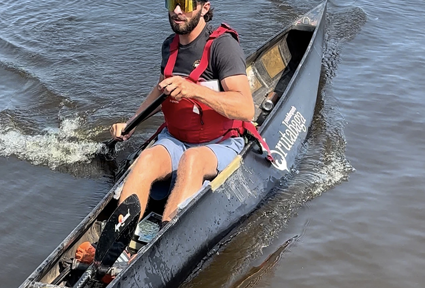 man in canoe